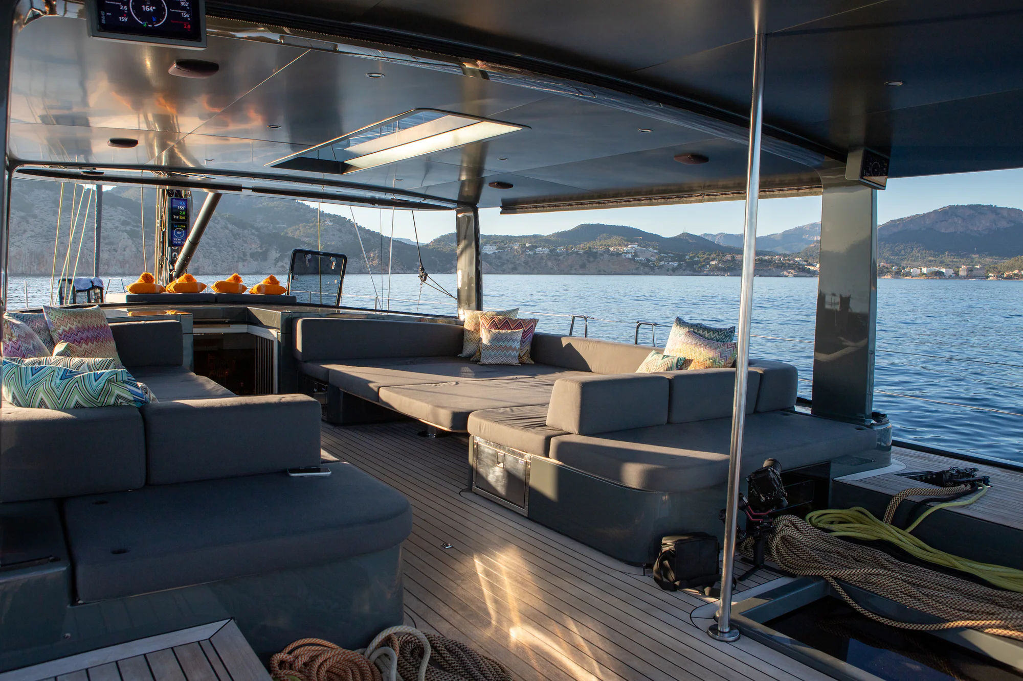 Two guests enjoying a pasta lunch in the cockpit of Sailing Yacht W, the open sea beyond
