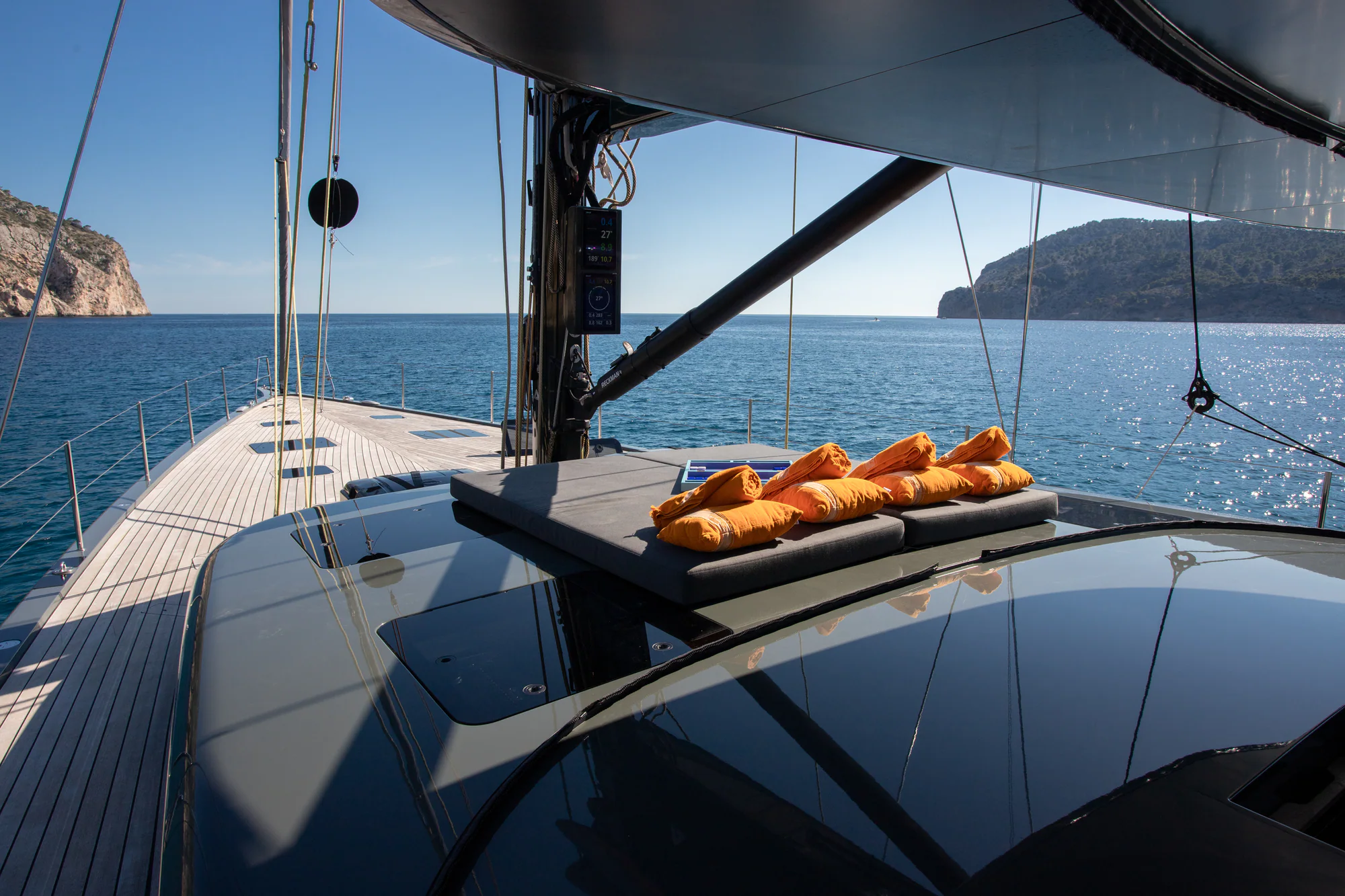 Forward sunpads on the foredeck of Sailing Yacht W at golden hour